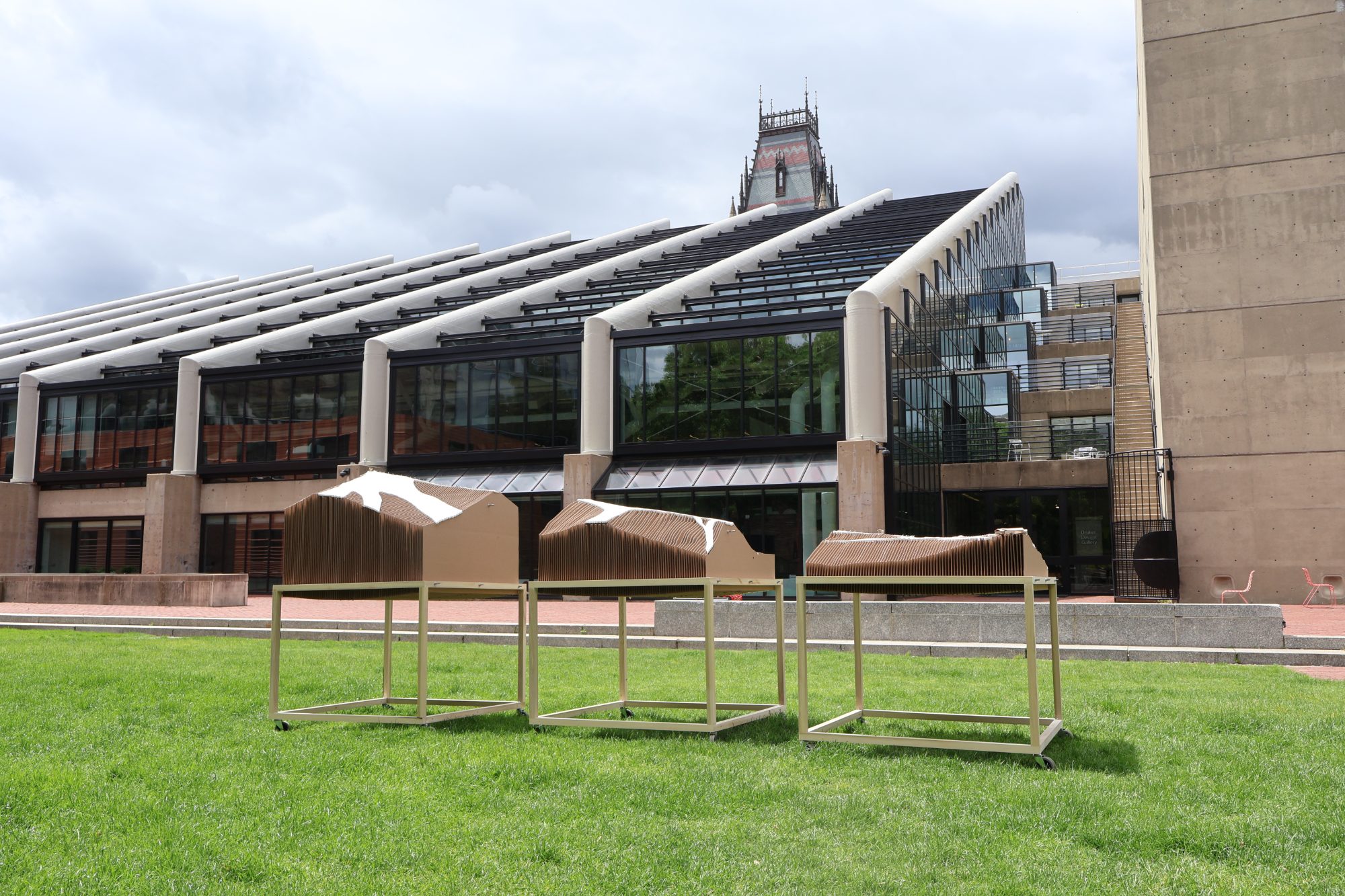 The three models on their rolling frames on the lawn outside Gund Hall