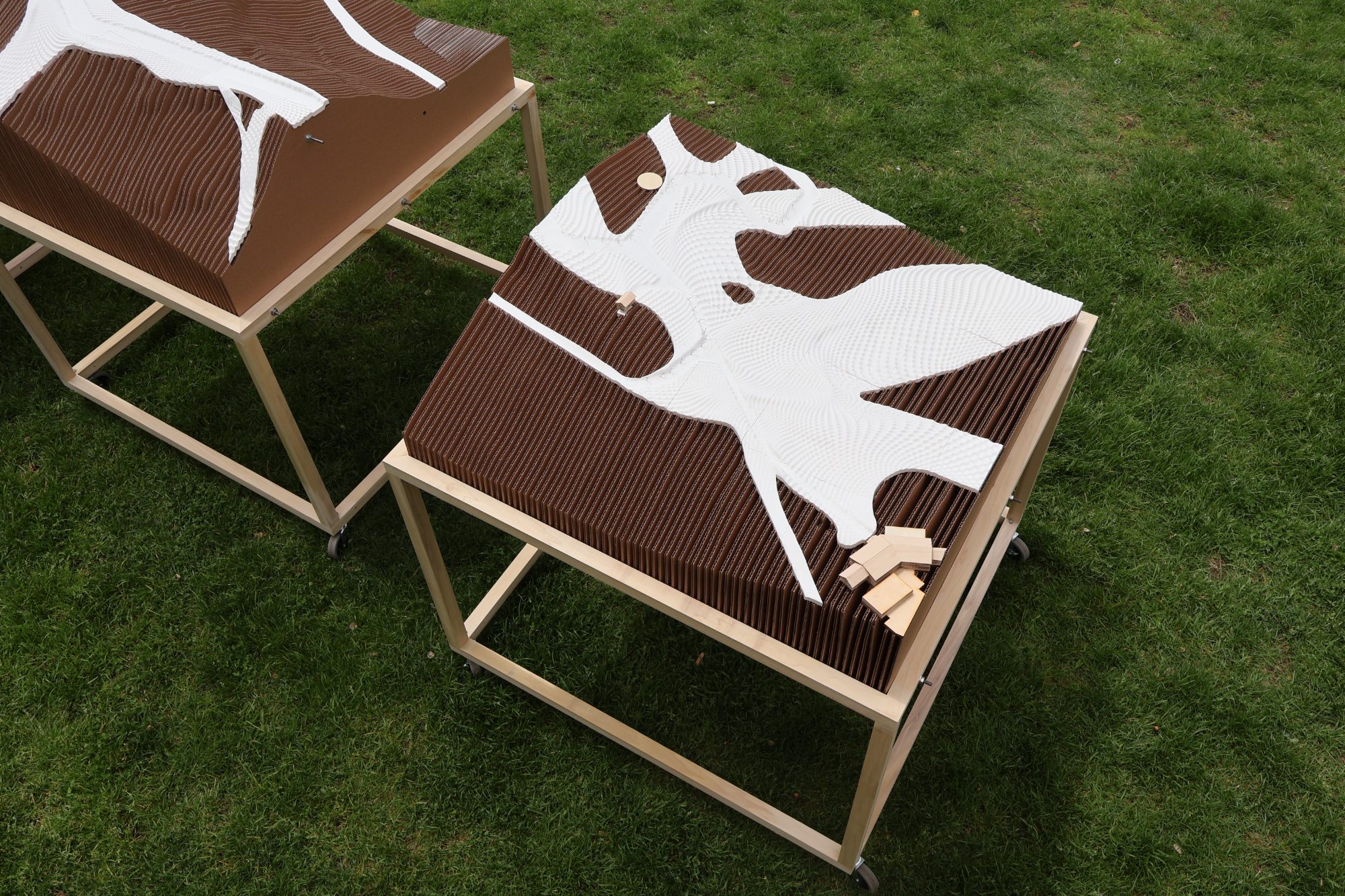 Two models on rolling frames, oblique view over the run surface